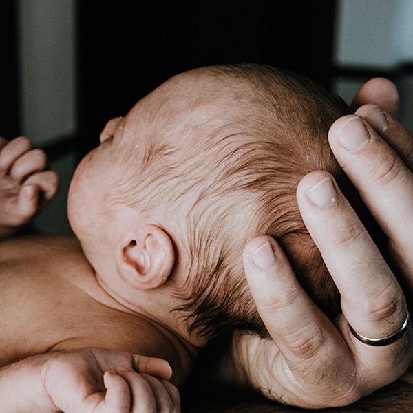 Parent with child born through surrogacy